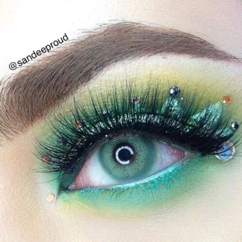 Pitchy Batis Green monthly colored contacts for dark eyes feature a defined limbal ring with vibrant green color that stands out while maintaining a balanced look.