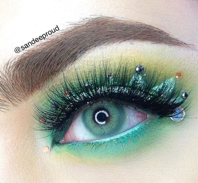 Pitchy Batis Green monthly colored contacts for dark eyes feature a defined limbal ring with vibrant green color that stands out while maintaining a balanced look.