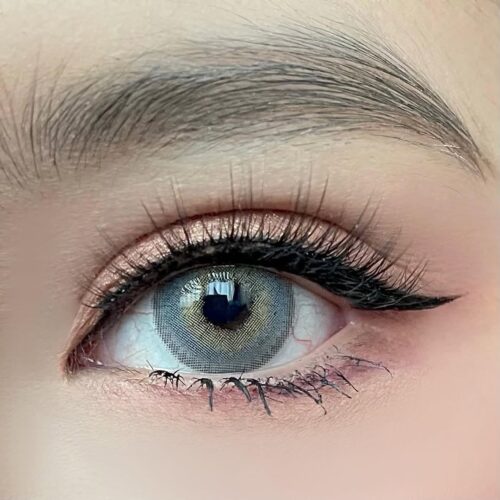 Dreamcolor Moonwalk Gray monthly colored contacts enhance dark eyes with layered gray tones and soft enlargement for a natural look. Powers 0.00 to -10.00.