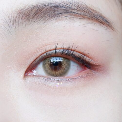 Kitty Kawaii Fifi Brown monthly colored contacts enhance dark eyes with a soft limbal ring and warm brown blend for a natural look. Available in powers 0.00 to -10.00