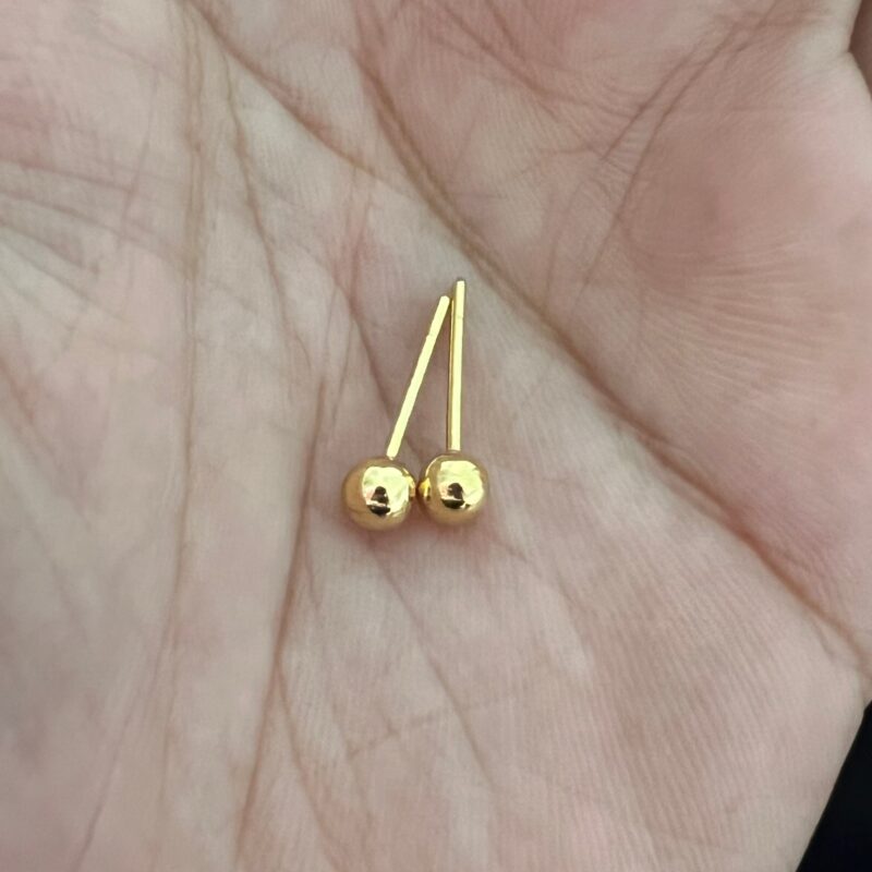 a pair of real gold ball earrings