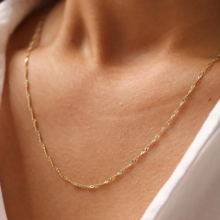 18K solid gold Singapore chain with a sparkling twisted design. A dainty, durable necklace that adds elegant shine to everyday wear or layered looks.