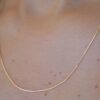 9K solid gold box chain necklace with a sleek, dainty profile. A classic, durable chain offering everyday luxury, perfect for layering or wearing solo.