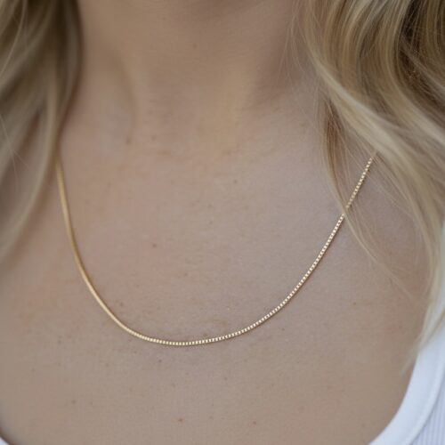 9K solid gold box chain necklace with a sleek, dainty profile. A classic, durable chain offering everyday luxury, perfect for layering or wearing solo.