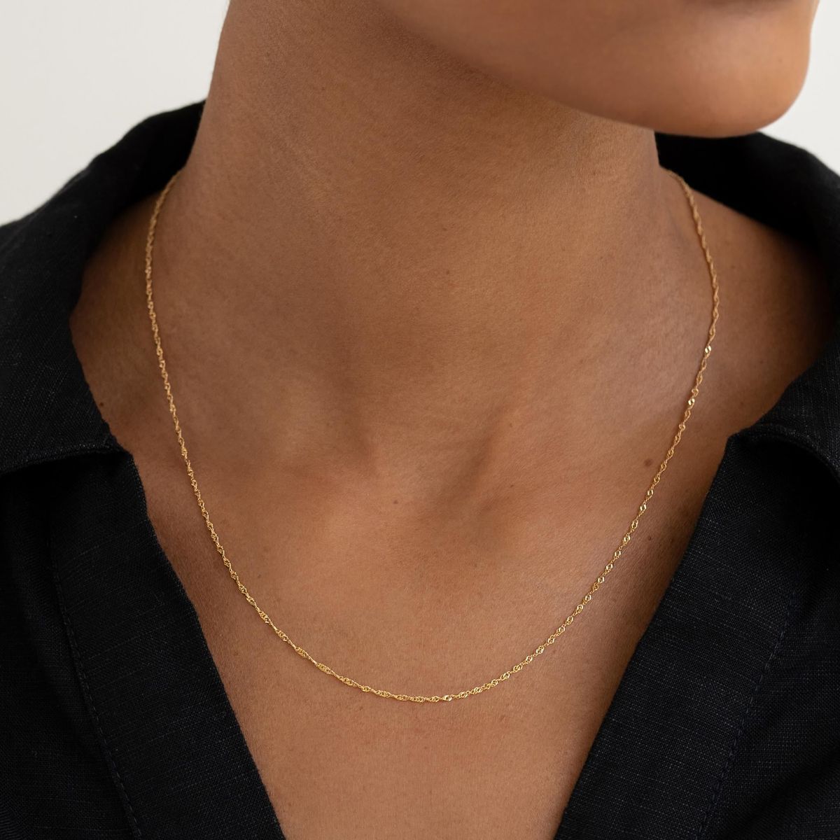 9K solid gold Singapore chain necklace in Au 375 real gold. Twisted rope design with radiant shine, dainty durable chain, perfect for layering wear.