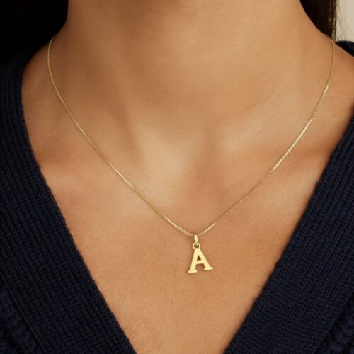 24K solid gold initial pendant in a bold 3D letter design. A dainty, personalized charm crafted in pure gold, perfect as a meaningful keepsake or gift.