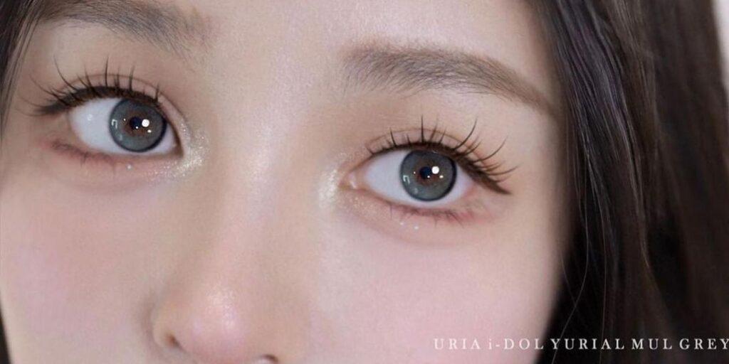 Uria Mul Gray yearly colored contacts on dark eyes showing cool blue-gray with warm brown center depth and soft dark limbal ring